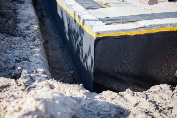 Professional Basement Waterproofing technician working in Arcadia, OH